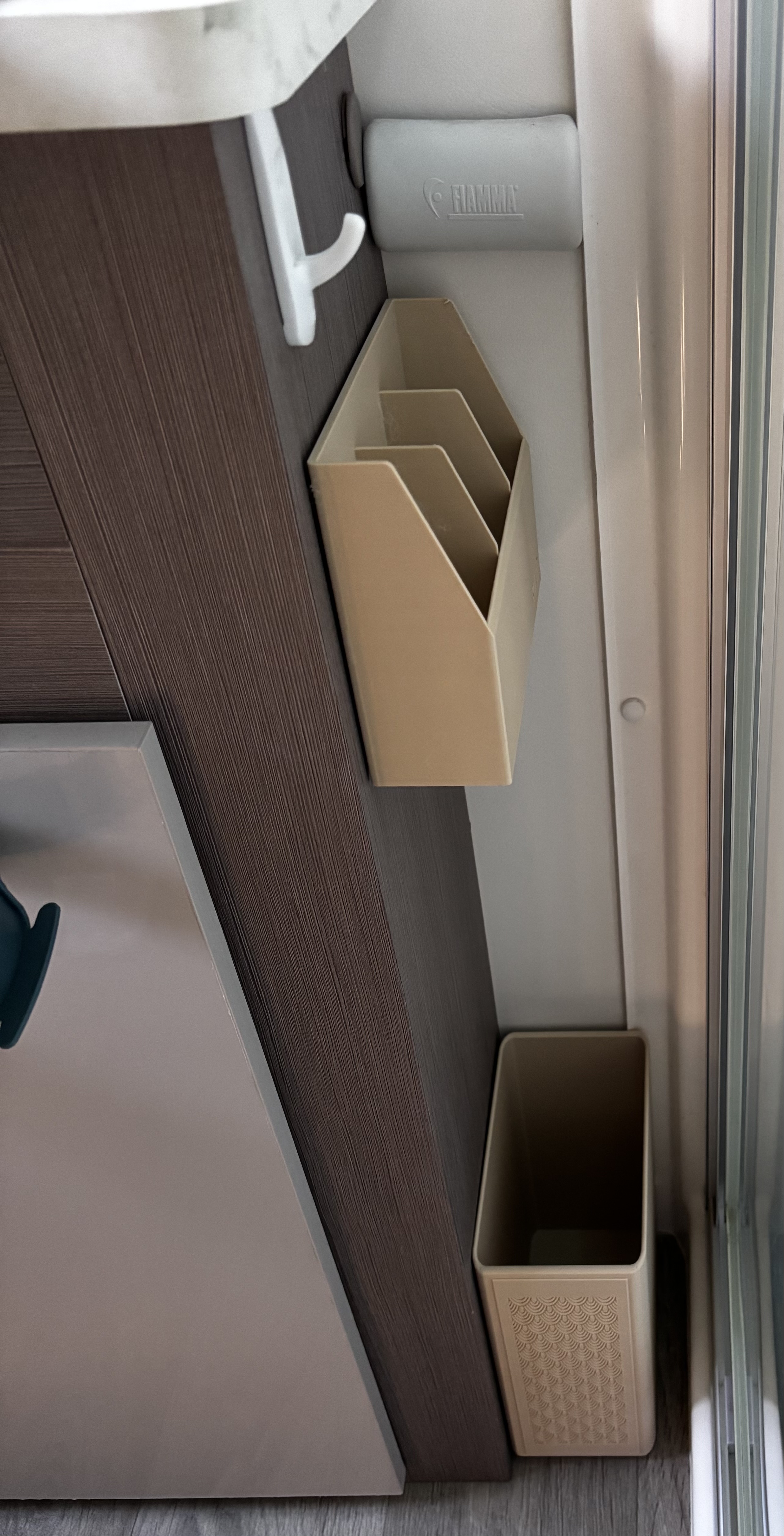 Storage Pockets mounted on bathroom wall, tan finish