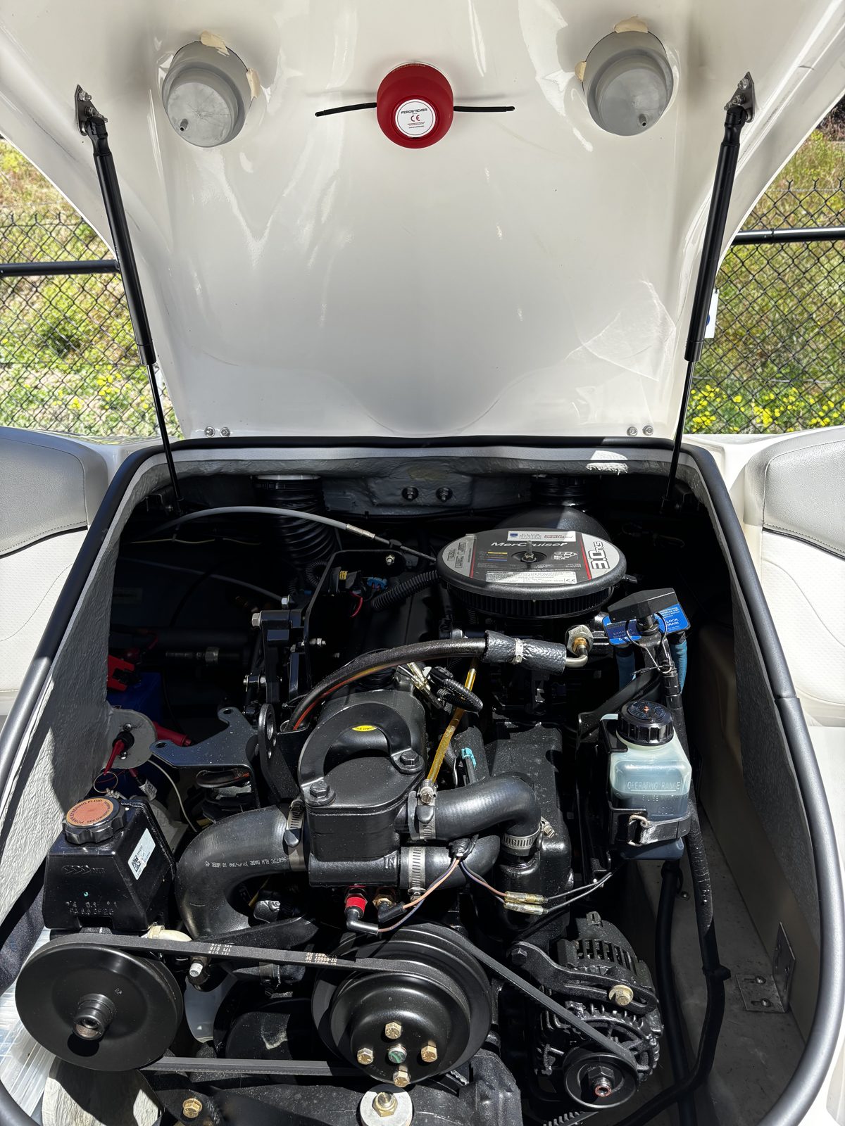 Boat engine hatch raised with a Ferosticker device fitted to its underside