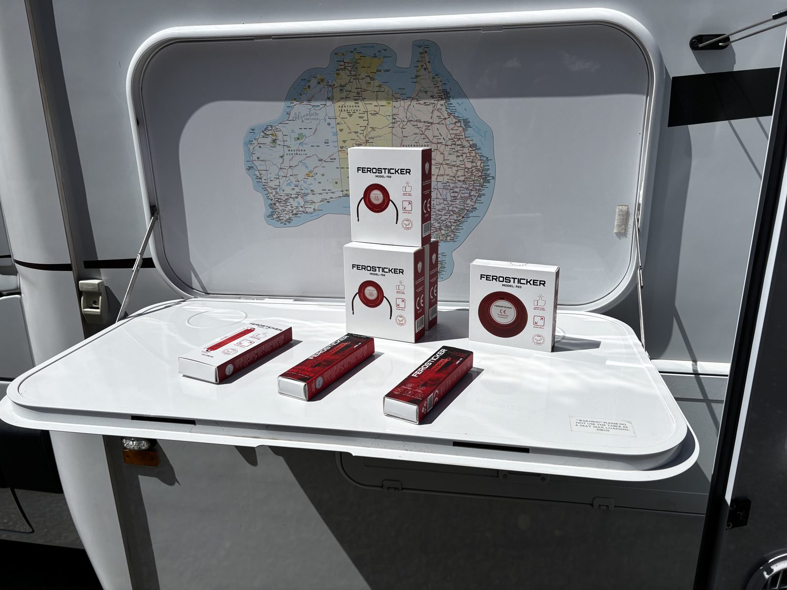 Ferosticker round and strip devices and boxes laid out on an open caravan storage hatch
