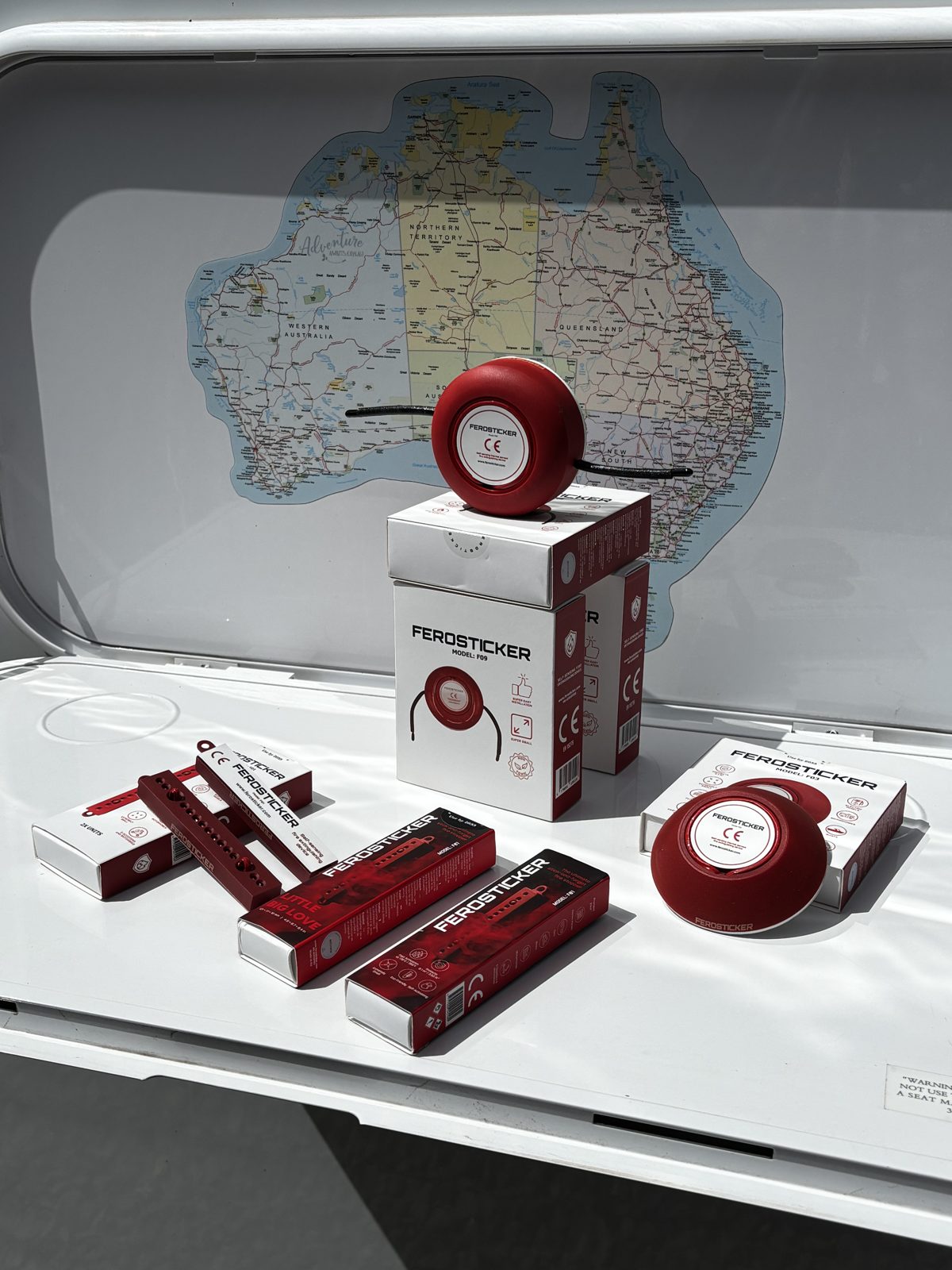 Round Ferosticker device sitting on top of product boxes with strip devices around it