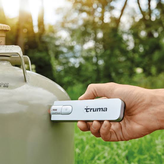 Device held against a gas cylinder to take a reading