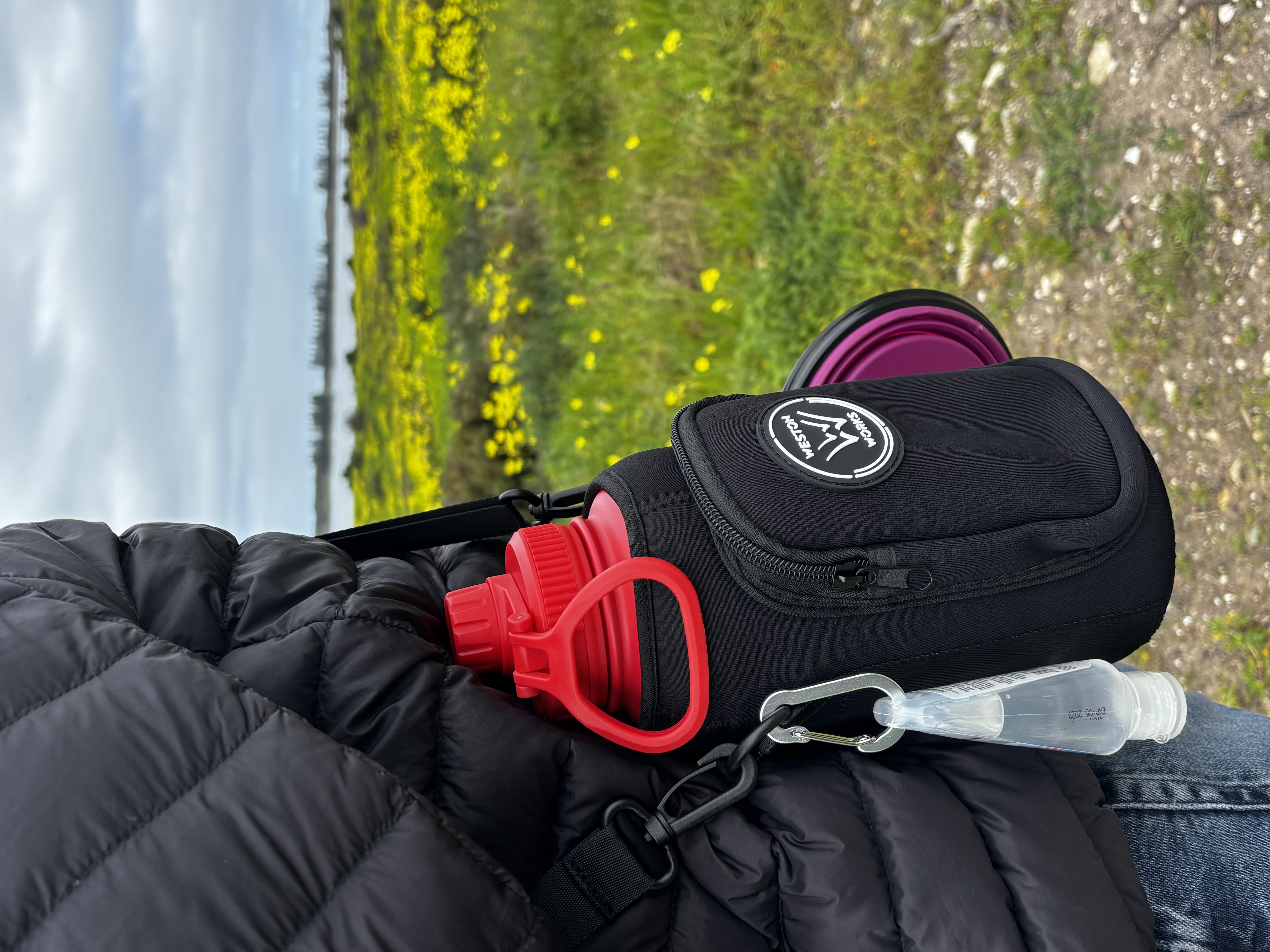 Close-up of the WestonWorks carry pouch worn crossbody outdoors
