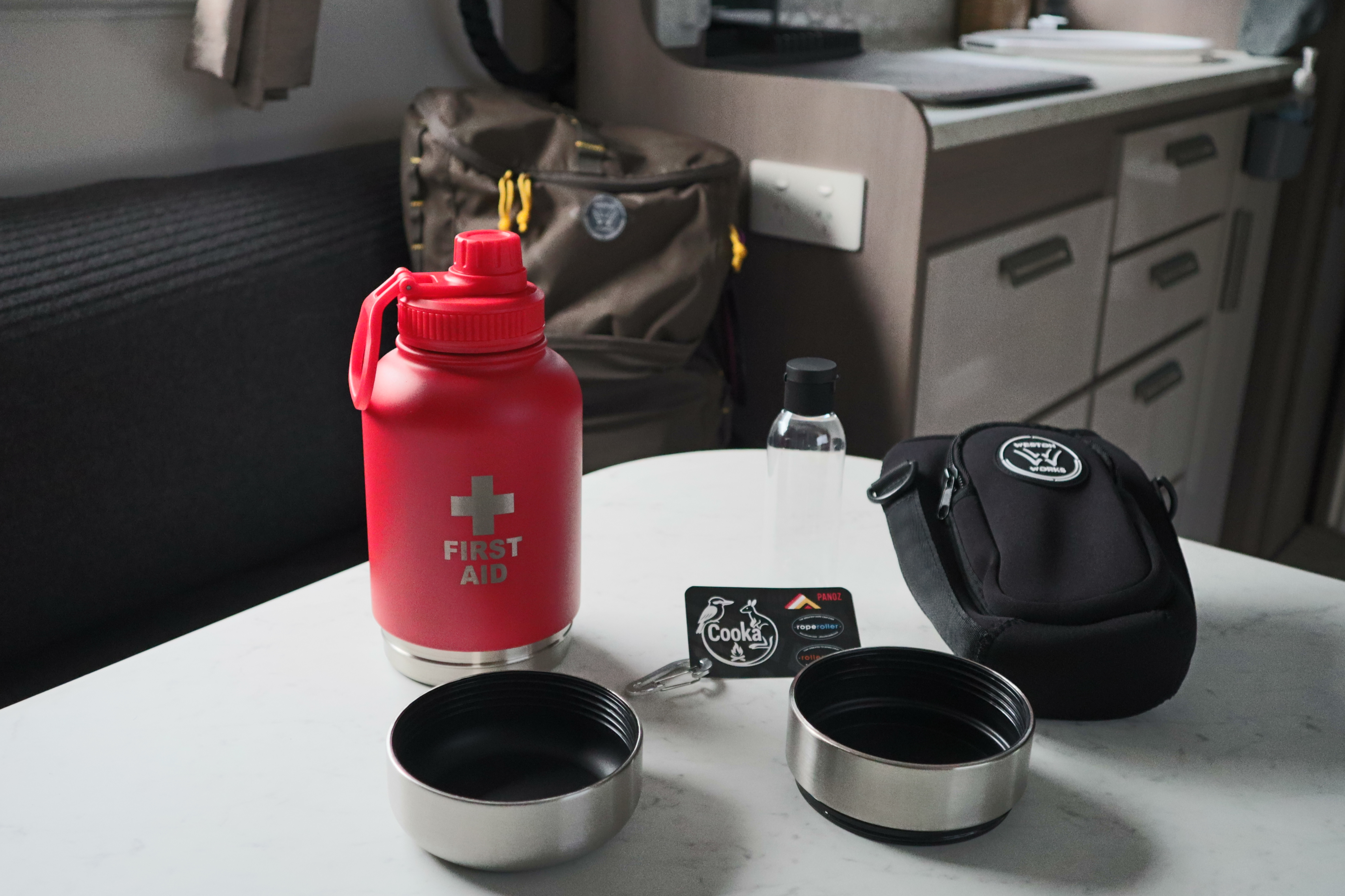 WestonWorks First Aid Bottle disassembled showing two stainless steel storage cups